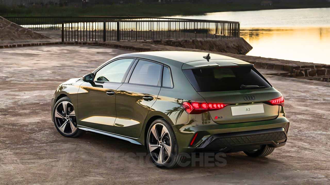 Al atardecer, el Nuevo Audi A3 2025, de un impresionante tono verde, se encuentra estacionado elegantemente sobre una superficie de piedra a la orilla del agua. - ofertamotor.es